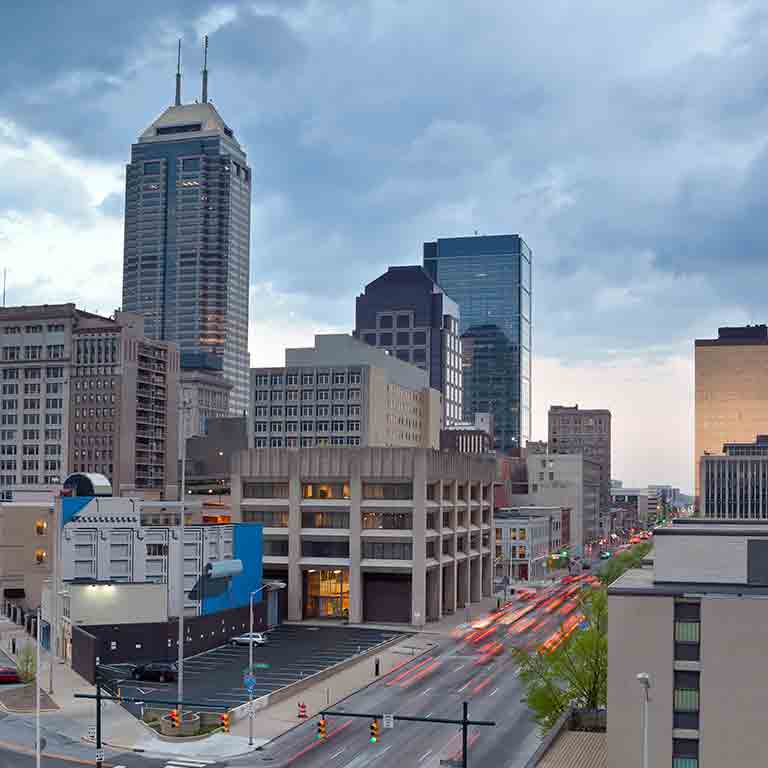 Tall buildings and moving cars in downtown Indianapolis